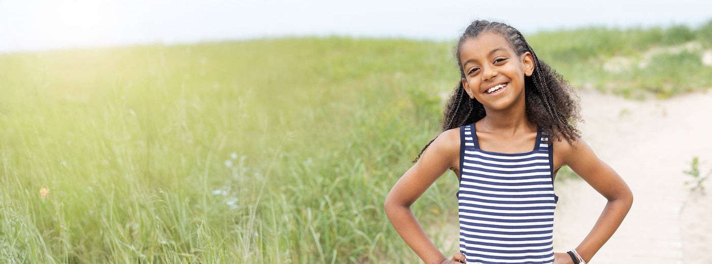 tween girl in navy stripe dress